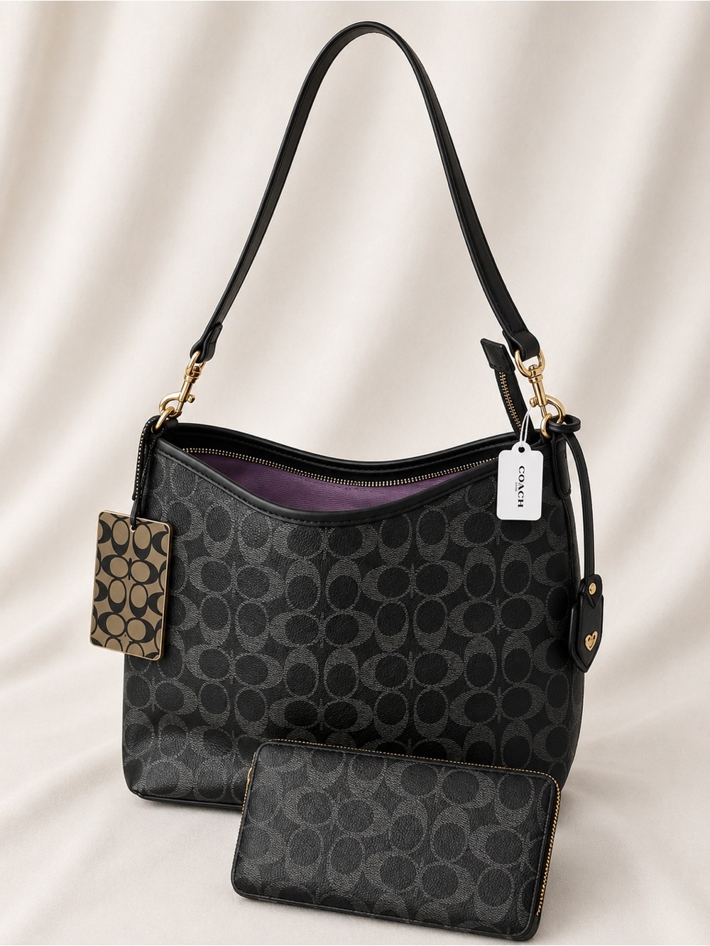 Coach Black Signature Canvas Shoulder Bag with Purple Interior Accent
